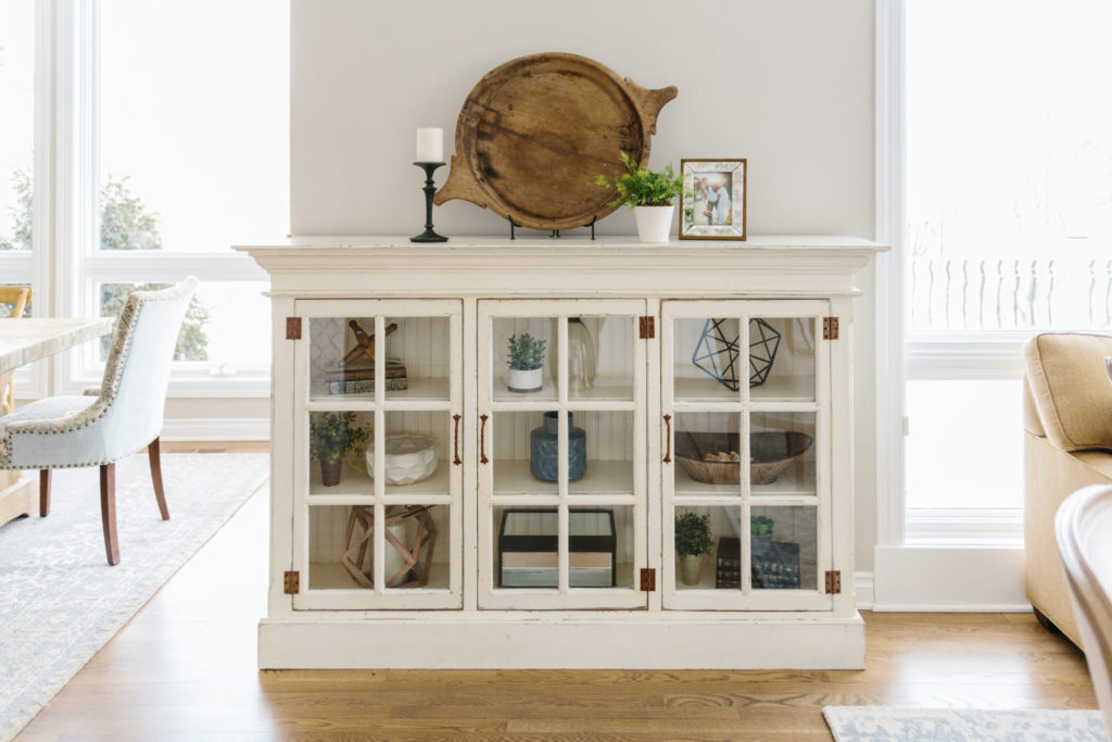 Styled accessories in a cased cabinet