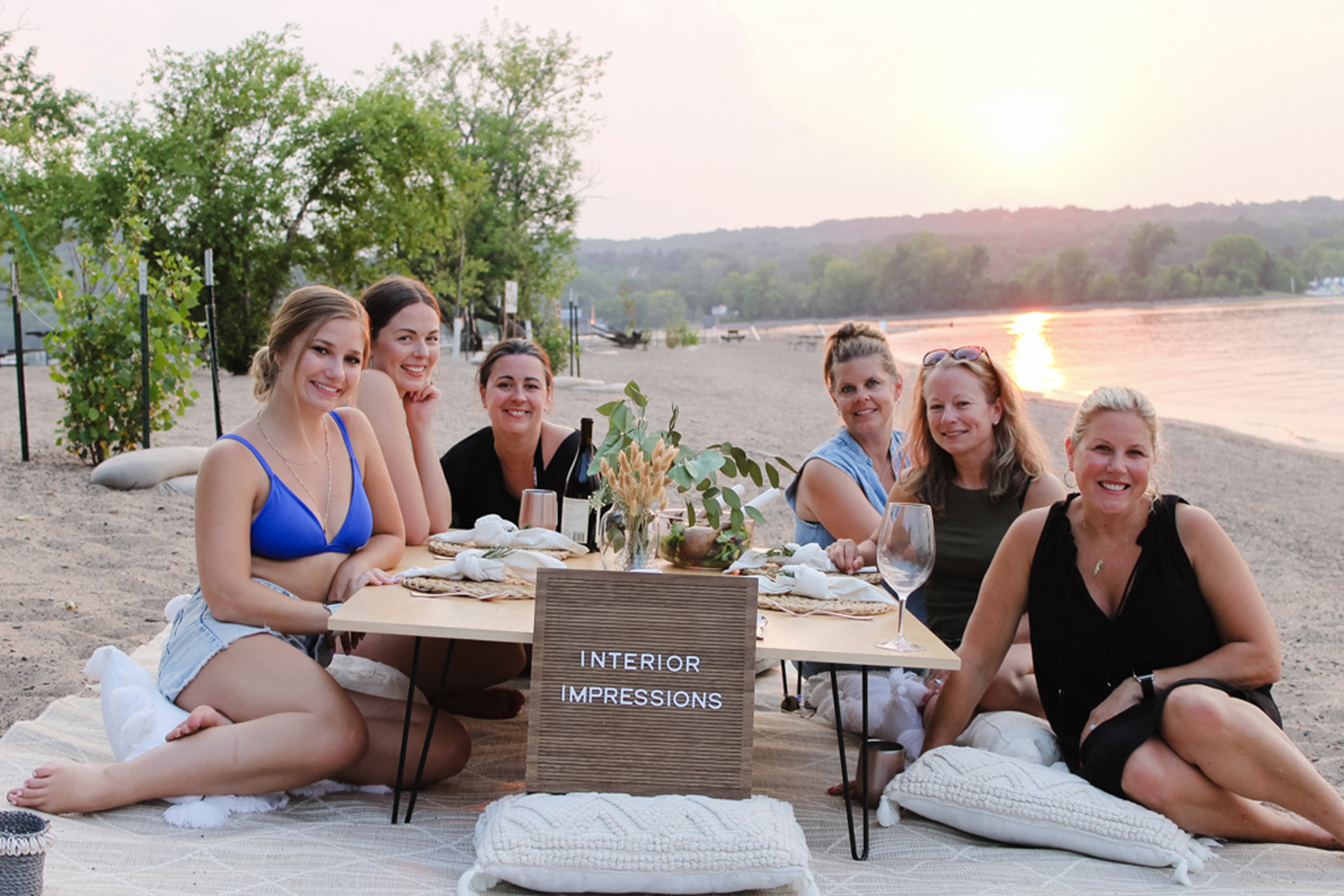 https://interiorimpressions.org/wp-content/uploads/2021/07/Interior-Impressions-Woodbury-MN-Boat-Day-Pillows-and-Prosecco-Picnic-Team-Photo.jpg